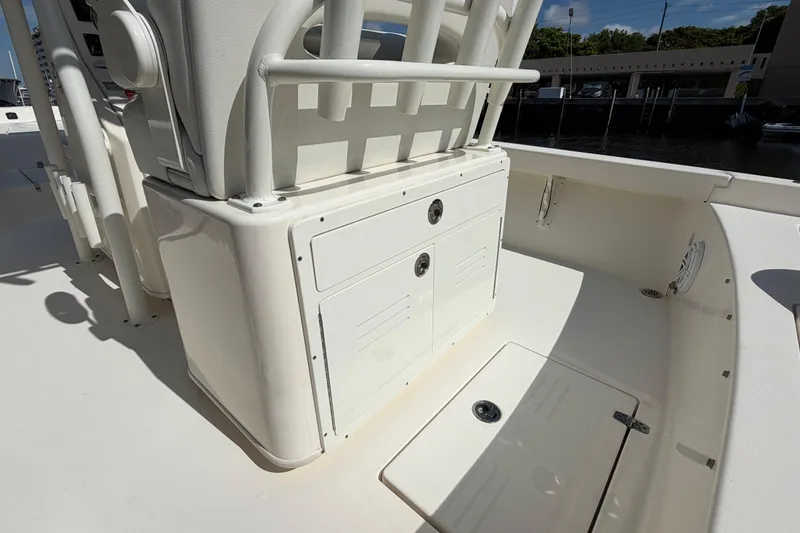 Slide: The Image of 2022 Pathfinder 2600 HPS boat interior with storage compartments and seating area. - 36