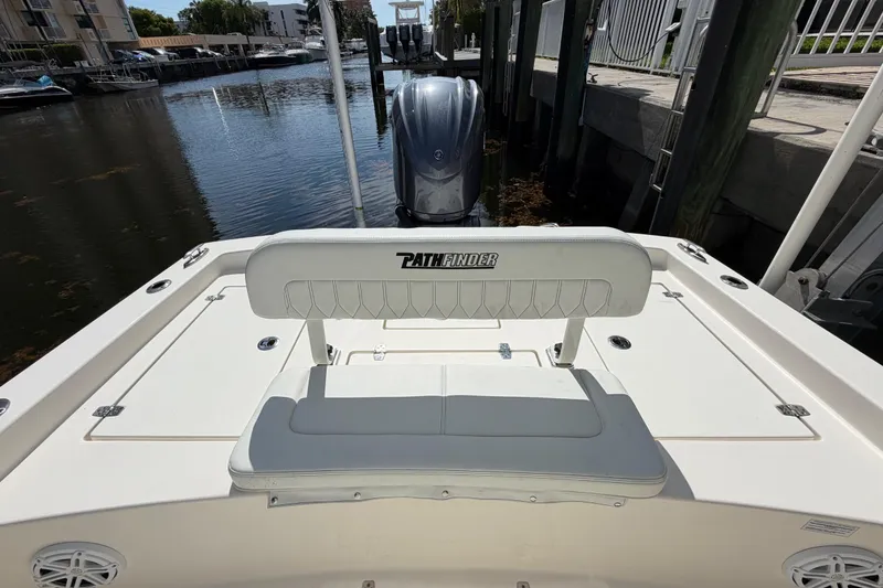 Slide: The Image of 2022 Pathfinder 2600 HPS boat with seating, docked in a marina. - 43