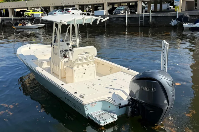 Slide: The Image of 2022 Pathfinder 2600 HPS boat docked, featuring Yamaha outboard motor. - 5
