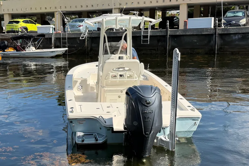 Slide: The Image of 2022 Pathfinder 2600 HPS boat docked, featuring a powerful Yamaha V6 outboard engine. - 6