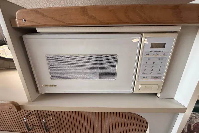 Slide: The Image of GoldStar microwave in 1998 Four Winns 258 Vista boat kitchen area. - 29