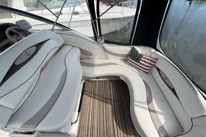 Slide: The Image of Interior of 1998 Four Winns 258 Vista boat with American flag pillow. - 9