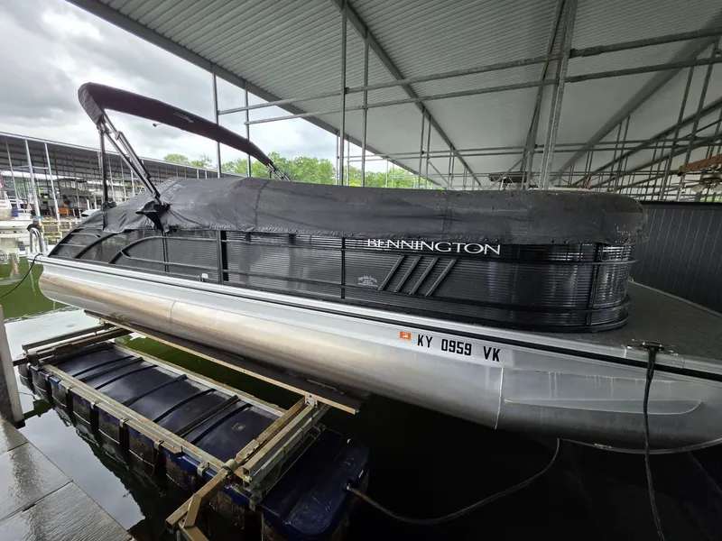 Slide: The Image of Bennington 25LSB 2022 pontoon boat docked under shelter. - 14