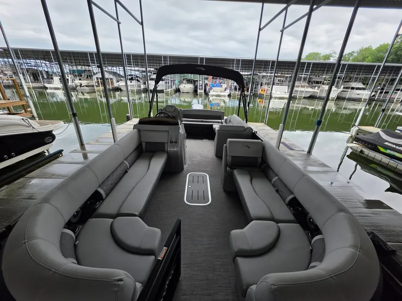 Slide: The Image of Interior of a 2022 Bennington 25LSB pontoon boat at the dock. - 23