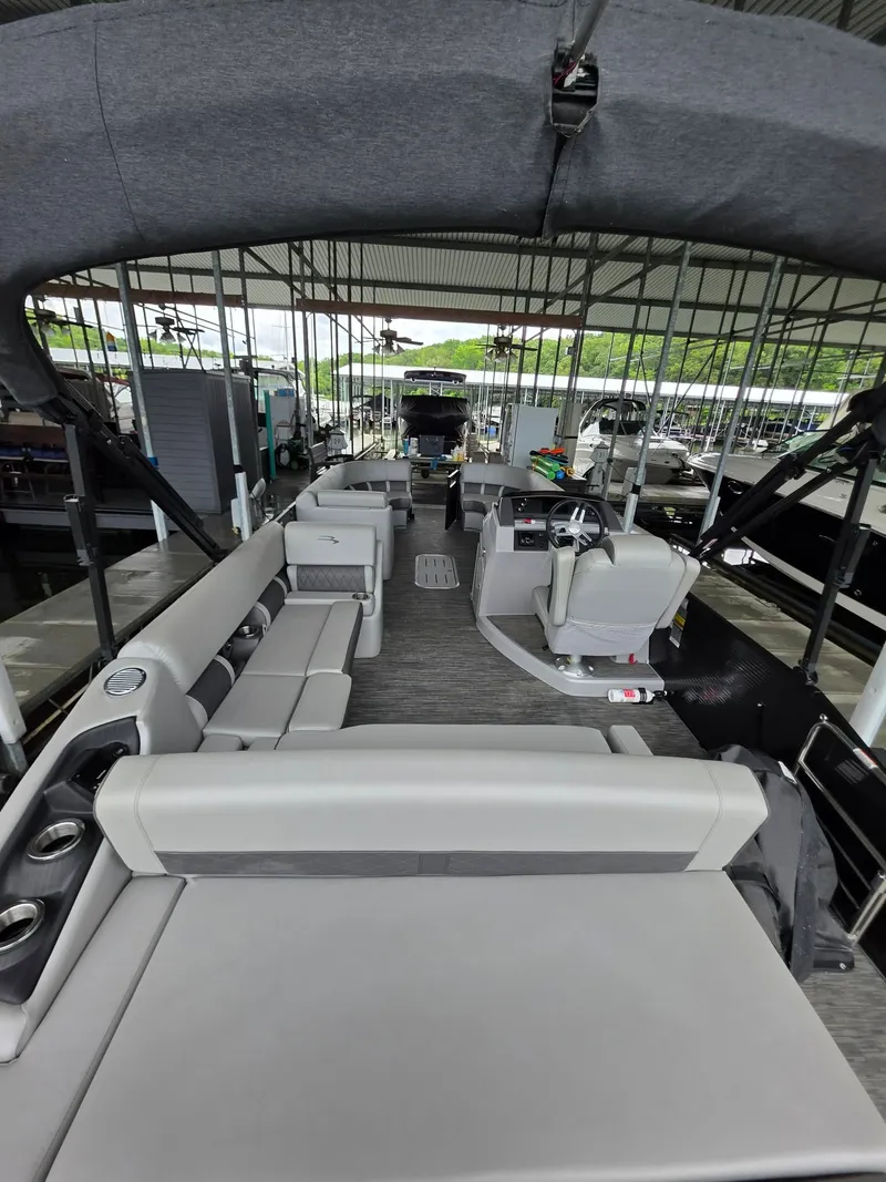 Slide: The Image of Interior view of a 2022 Bennington 25LSB pontoon boat in a dock. - 24