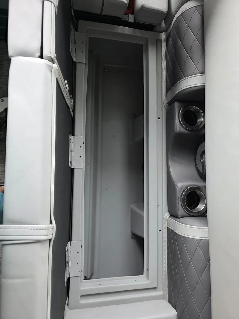 Slide: The Image of Interior of a 2022 Bennington 25LSB boat with storage compartment. - 36