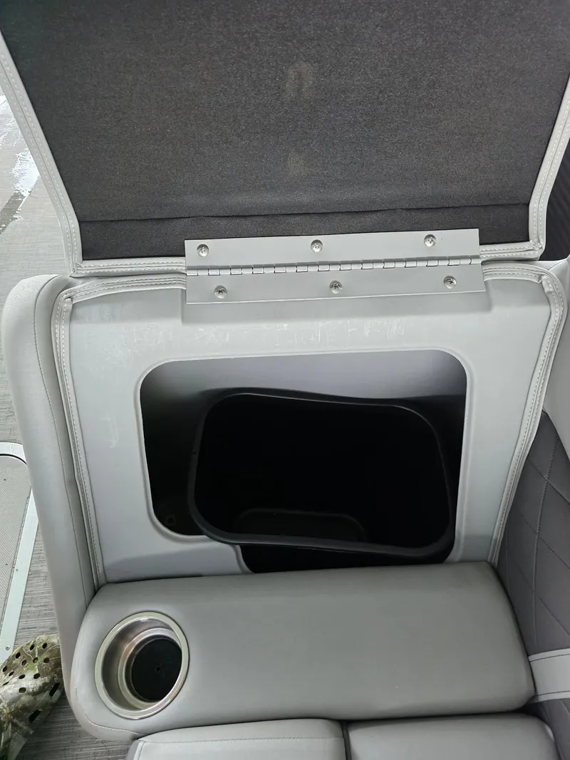 Slide: The Image of Bennington 25LSB 2022 seat with storage compartment and cup holder. - 37