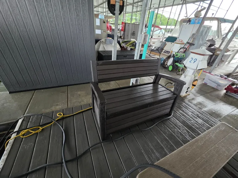 Slide: The Image of Wooden bench on dock with Bennington 25LSB in background. - 40