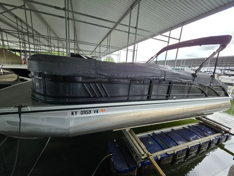 Slide: The Image of Bennington 25LSB 2022 pontoon boat docked, covered. - 5