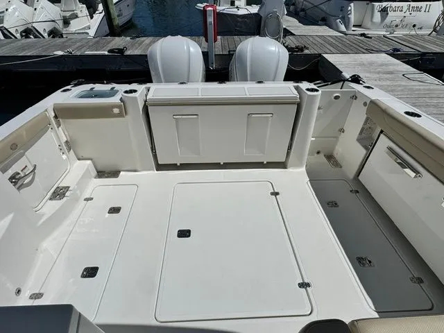 Slide: The Image of Interior view of a 2021 Pursuit 326 DC boat at the dock. - 16