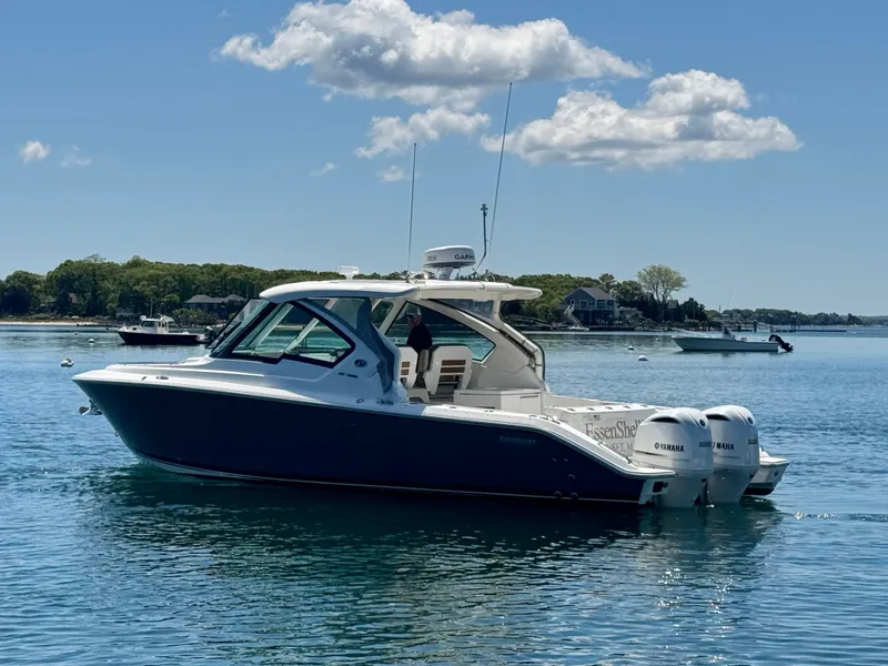 Slide: The Image of Pursuit 326 DC boat 2021 on calm water. - 8