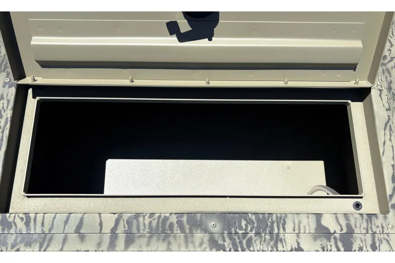 Slide: The Image of Open storage compartment of 2026 Tracker Grizzly 1860 Utility boat. - 17