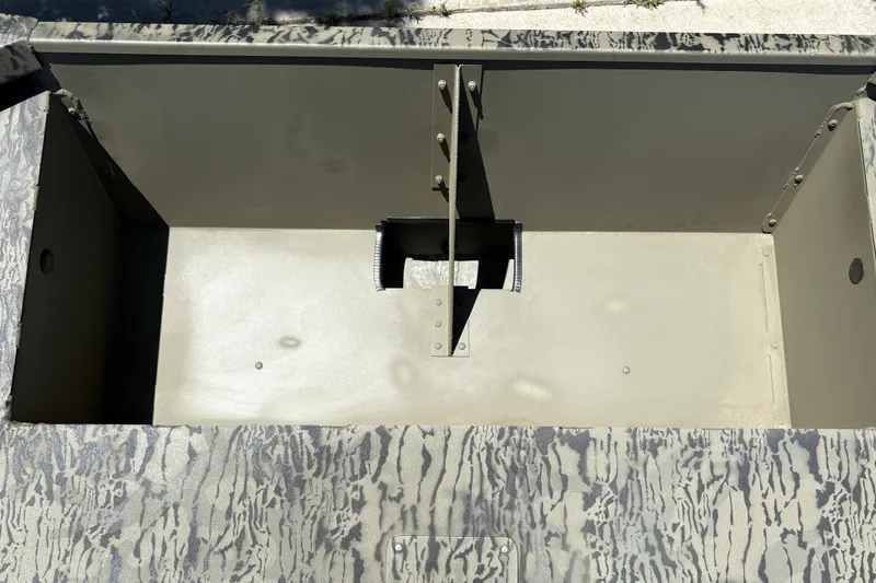 Slide: The Image of Interior view of 2026 Tracker Grizzly 1860 Utility boat storage compartment. - 13