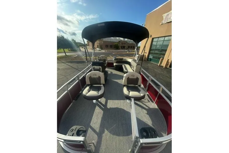 Slide: The Image of 2026 Sun Tracker Bass Buggy 16 XL Select pontoon boat with seating and canopy. - 4