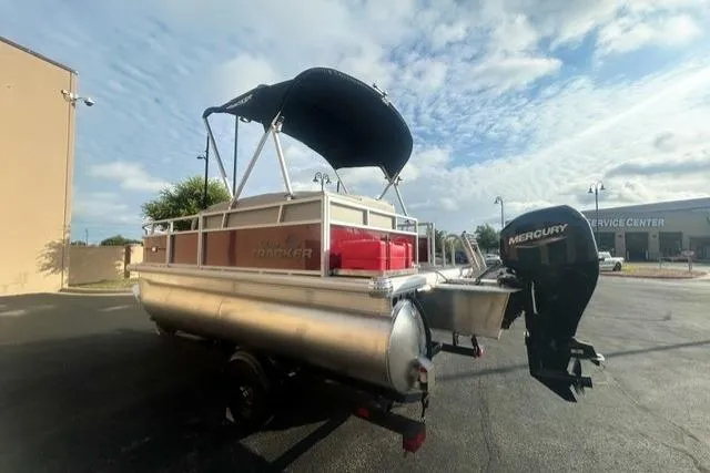 Slide: The Image of 2026 Sun Tracker Bass Buggy 16 XL Select pontoon boat with Mercury outboard motor. - 3