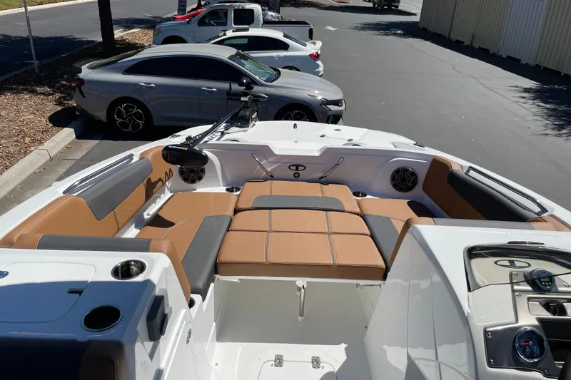Slide: The Image of Interior view of a 2026 Tahoe 1950 boat with tan seating and modern dashboard. - 13