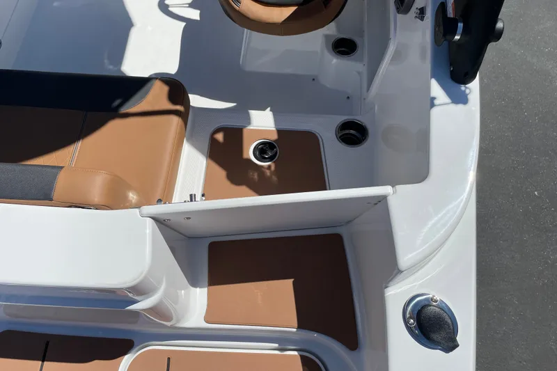 Slide: The Image of Interior of 2026 Tahoe 1950 boat with tan seating and cup holders. - 9