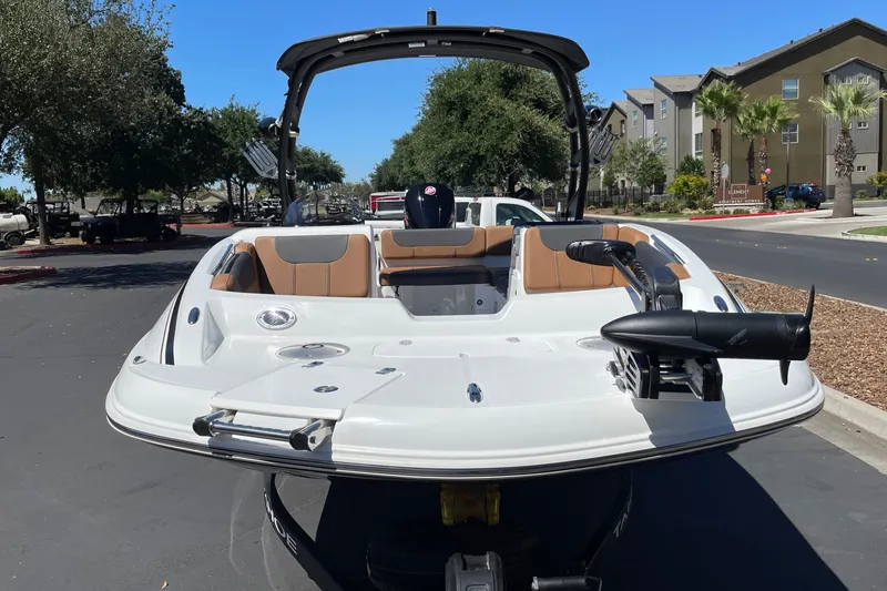 Slide: The Image of 2026 Tahoe 1950 boat with sleek design, parked outdoors on a sunny day. - 4