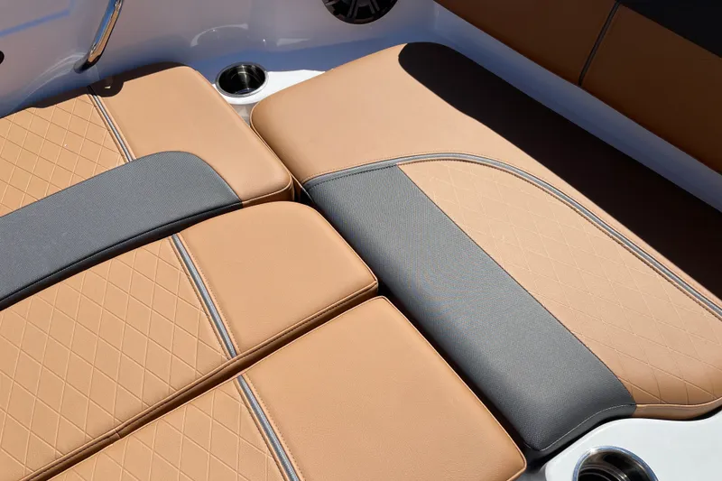 Slide: The Image of Luxurious tan and gray seating in 2026 Tahoe 1950 boat interior. - 32