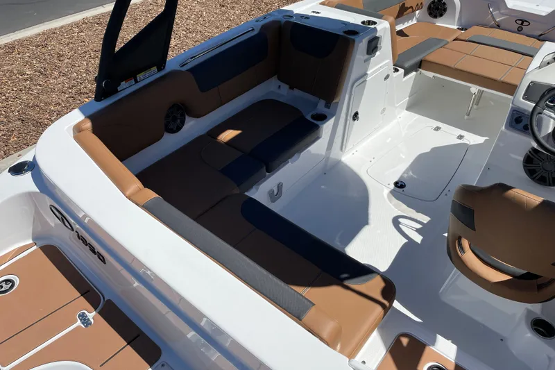 Slide: The Image of 2026 Tahoe 1950 boat interior with brown and black seating, modern design. - 8