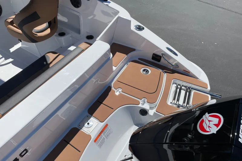 Slide: The Image of 2026 Tahoe 1950 boat interior with brown seating and modern design elements. - 6