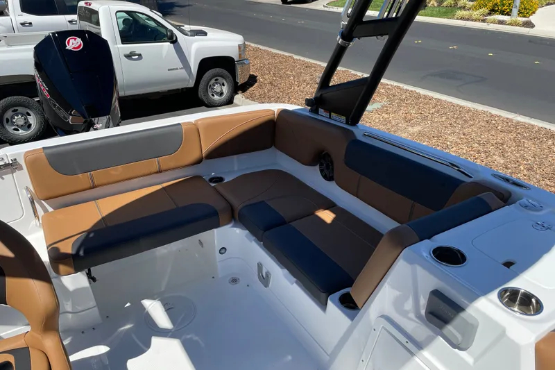 Slide: The Image of Interior of a 2026 Tahoe 1950 boat with tan and gray seating. - 10