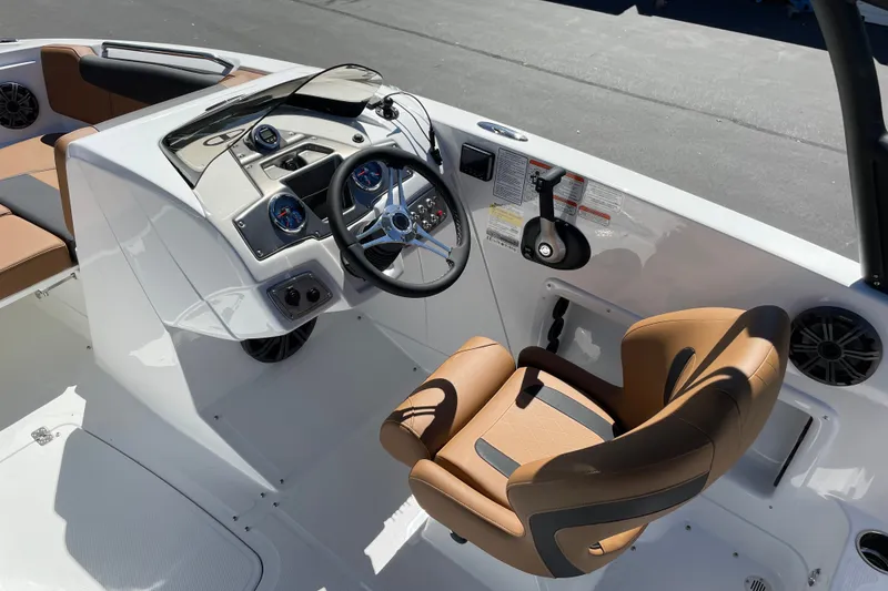 Slide: The Image of Interior of a 2026 Tahoe 1950 boat featuring a modern helm and comfortable seating. - 12