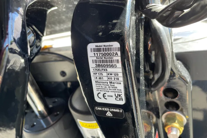 Slide: The Image of Label on a 2026 Tahoe 1950 model, displaying serial and model numbers. - 152