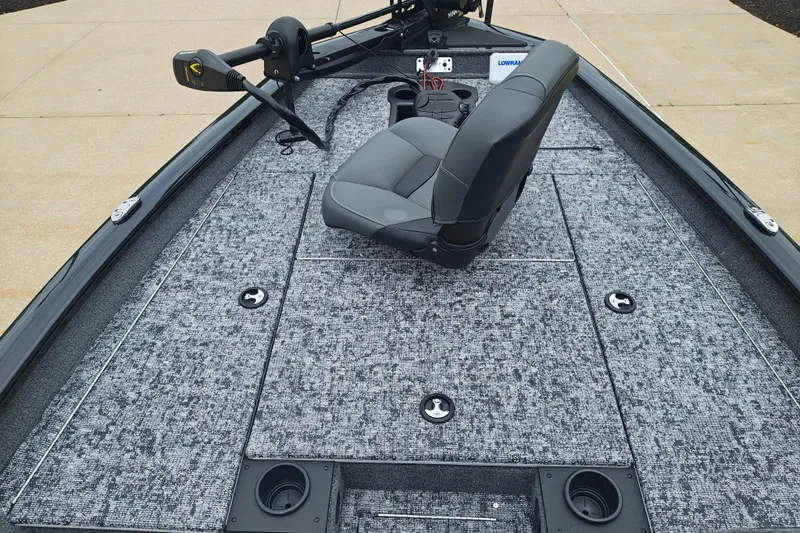 Slide: The Image of 2026 Tracker Pro Team 175 boat interior with gray seating and carpeted deck. - 11
