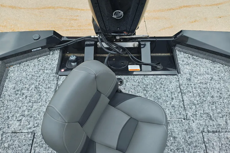 Slide: The Image of 2026 Tracker Pro Team 175 boat interior with gray seating and carpeted flooring. - 15