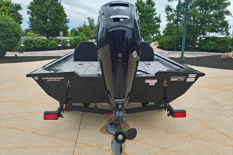 Slide: The Image of 2026 Tracker Pro Team 175 boat with Mercury engine, parked outdoors on a trailer. - 3