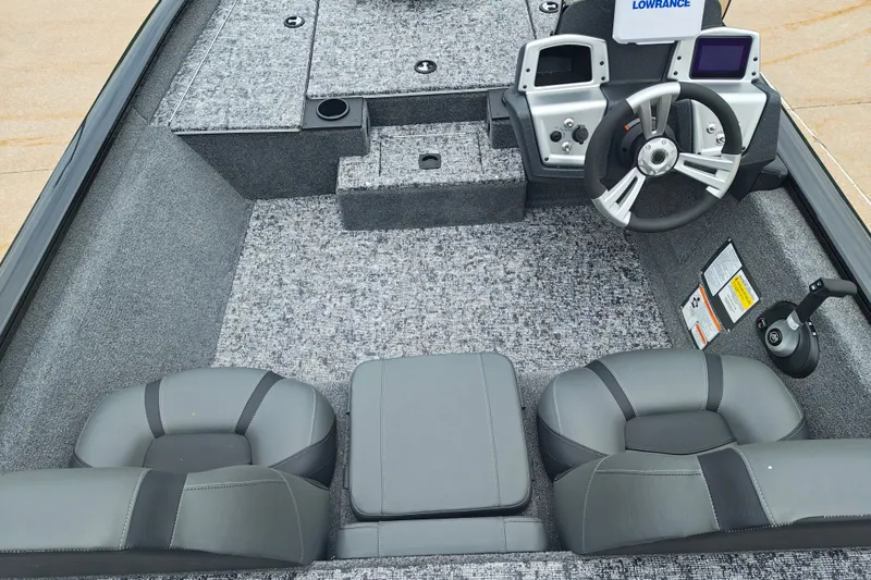 Slide: The Image of 2026 Tracker Pro Team 175 boat interior with steering wheel and seating. - 7