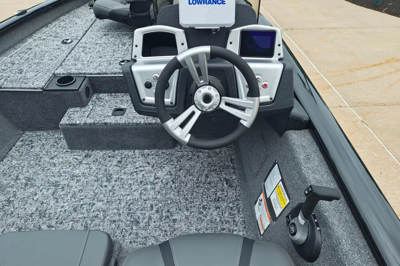 Slide: The Image of 2026 Tracker Pro Team 175 boat interior with steering wheel and control panel. - 8