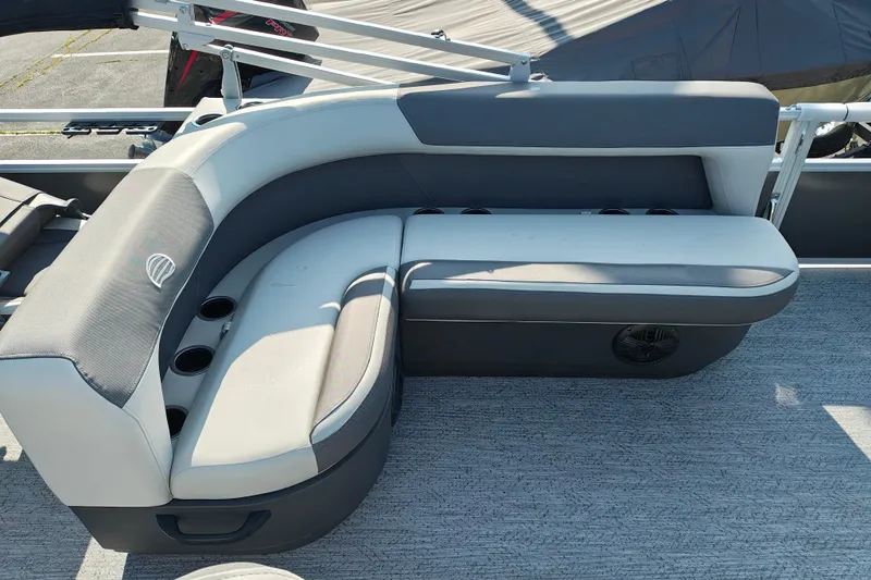 Slide: The Image of 2026 Sun Tracker Bass Buggy 18 DLX pontoon boat seating area with cup holders. - 15