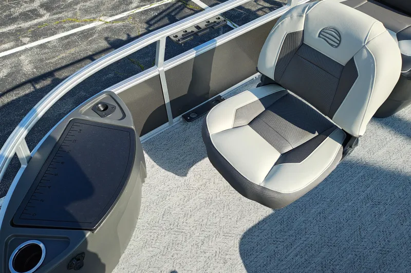 Slide: The Image of 2026 Sun Tracker Bass Buggy 18 DLX boat interior with comfortable seating and measuring panel. - 6