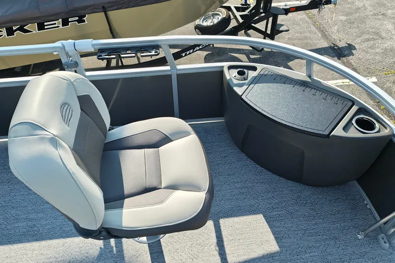 Slide: The Image of 2026 Sun Tracker Bass Buggy 18 DLX boat seat and console with cup holders. - 7
