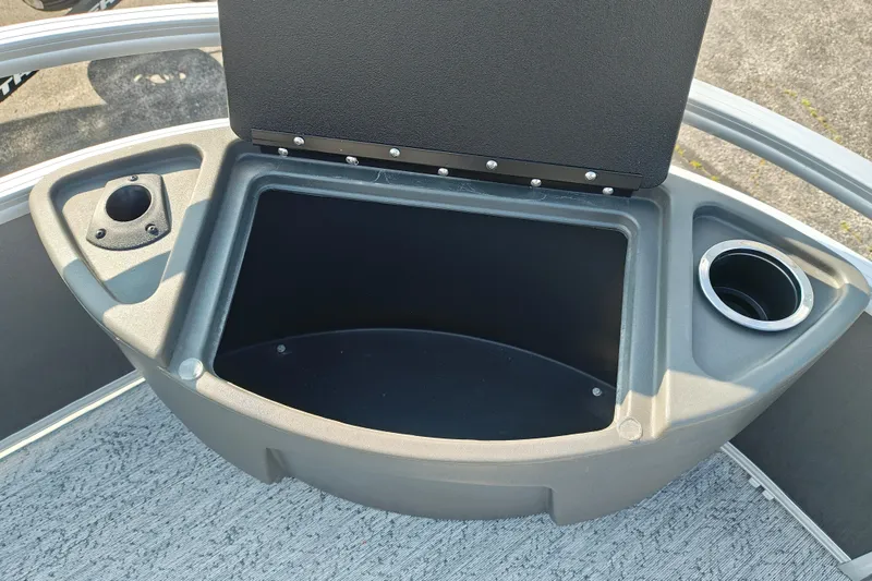 Slide: The Image of Storage compartment on 2026 Sun Tracker Bass Buggy 18 DLX boat with cup holders. - 8
