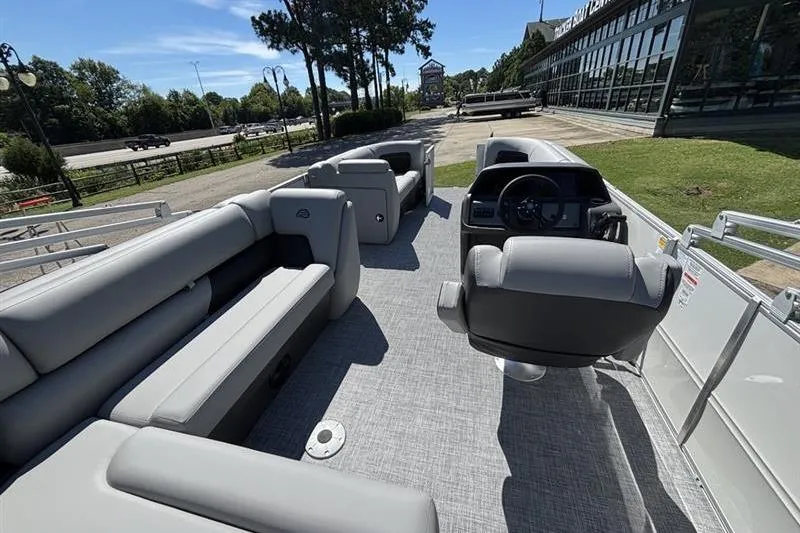 Slide: The Image of 2026 Sun Tracker Party Barge 20 DLX pontoon boat with spacious seating and modern design. - 4