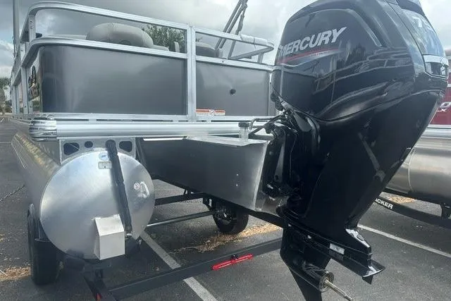 Slide: The Image of 2026 Sun Tracker Bass Buggy 18 DLX pontoon boat with Mercury outboard motor. - 3