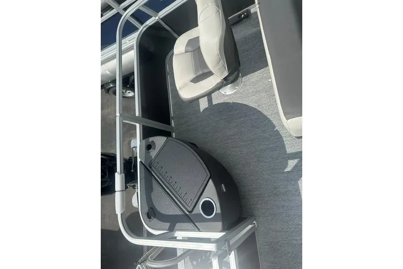 Slide: The Image of 2026 Sun Tracker Bass Buggy 18 DLX interior with seating and storage features. - 13