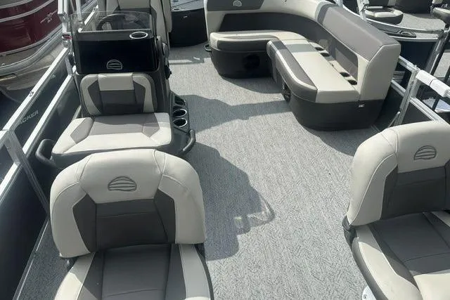 Slide: The Image of 2026 Sun Tracker Bass Buggy 18 DLX pontoon boat interior with cushioned seating and spacious layout. - 6