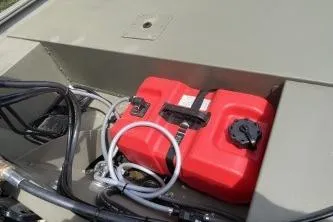 Slide: The Image of 2026 Tracker Grizzly 1648 SC boat with red fuel tank and hoses. - 5
