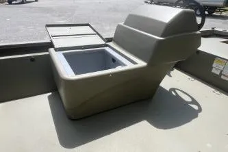 Slide: The Image of 2026 Tracker Grizzly 1648 SC boat interior with storage compartment open. - 7