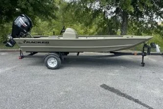 The Image of 2026 Tracker Grizzly 1648 SC boat on trailer, parked outdoors. - 0