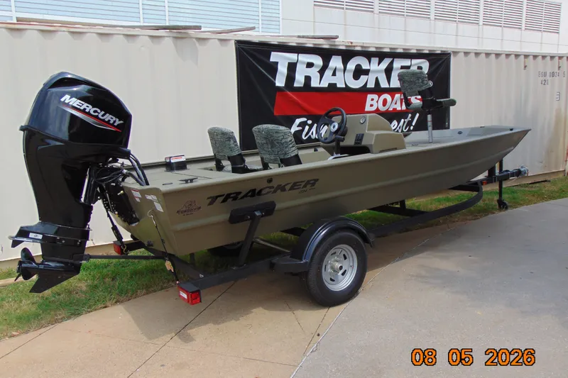 The Image of 2026 Tracker Grizzly 1754 SC boat with Mercury engine on trailer, displayed outdoors. - 0
