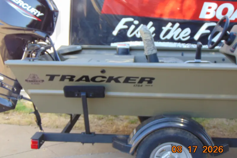 Slide: The Image of 2026 Tracker Grizzly 1754 SC boat on trailer, featuring Mercury engine. - 25