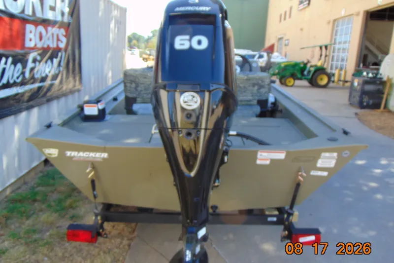Slide: The Image of 2026 Tracker Grizzly 1754 SC boat with Mercury 60 engine, displayed outdoors. - 14