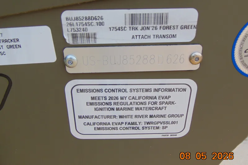 Slide: The Image of 2026 Tracker Grizzly 1754 SC emissions control label, compliance details, and serial number. - 23
