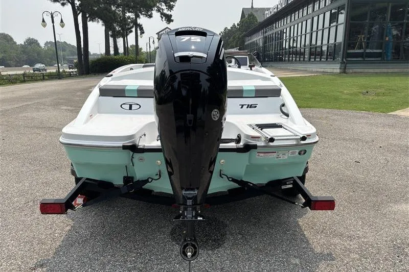 Slide: The Image of 2026 Tahoe T16 boat with Mercury 75 engine, parked outdoors. - 3