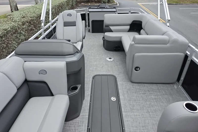 Slide: The Image of 2026 Sun Tracker SportFish 22 XP3 pontoon boat interior with gray seating and spacious layout. - 4